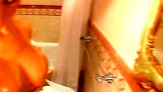 Hot babe with perfect big boobs taking shower