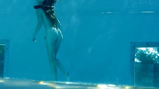 Beautiful Redhead's Playful Charm by the Poolside