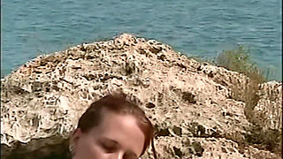 Horny Redhead Babe Fingers Pussy on Wild Beach