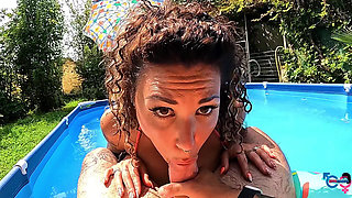 Italian Couple Exchanging Foreplay in the Pool in Front of Neighbors