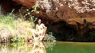 Wild girl posing naked and playing with herself outdoors