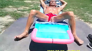 SUN TANNING AND THE COCK LOVES IT