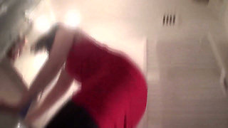Pointed heels crushing human doormat in the bathroom