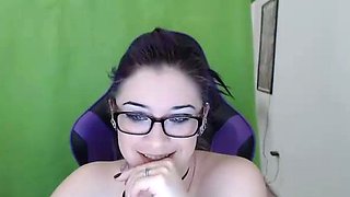 Small titted brunette Sharron with glasses masturbates