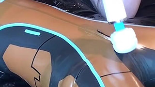 Latex Danielle is attached to the bed and masturbated with the massage vibrator