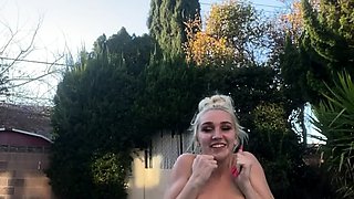 Blonde is flashing her big boobs in the outdoors