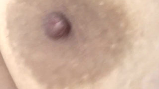 Mom plays with her big and delicious nipples