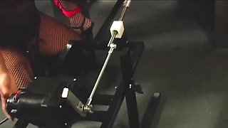 Hot lesbian BDSM session with a horny slut in stockins fucked with a machine