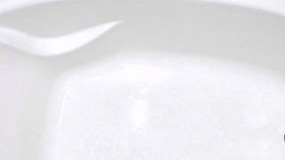 Soaking the bathtub with pee