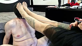 Foot worship, foot licking, foot fetish. Dominatrix Nika and her foot slave. Cock trampling