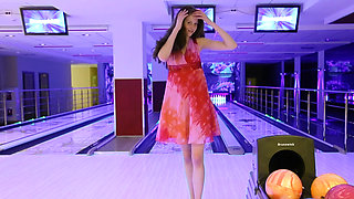 Brunette cutie stripped naked at the bowling alley