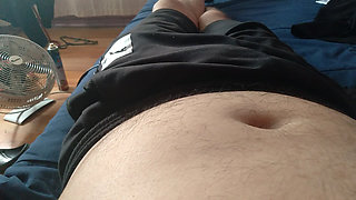 young man takes his thick penis in his hand