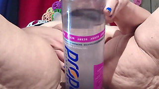 Big Bottle Plugged Clit Cunt