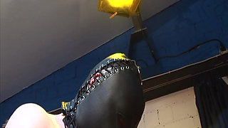 Dominatrix Trains Hooded Slave with Huge Dildo