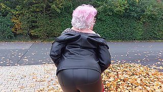 Naughty Granny Tongue Out Flashing Big Tits in Public