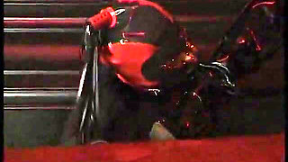 Two mistresses dominate and play with ebony girl and masked man