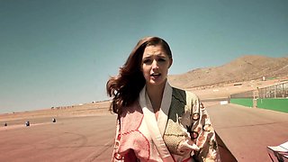 Big tits MILF posing behind the scenes