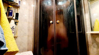 Nude Dominatrix takes a shower.  You have a chance to spy on your beloved Mistress taking a shower.
