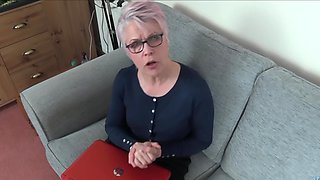 A hot mature woman with glasses fucks with a young man