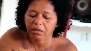Voluptuous ebony granny jerks off a big black cock in POV