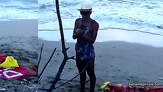 My stepdaughter teases me on the beach