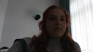 Hairy redhead bbw fingers her pussy on the bed