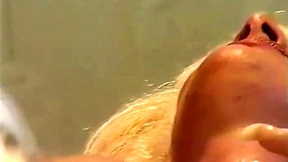 Blonde babe Dorina licking her friend pussy on the couch