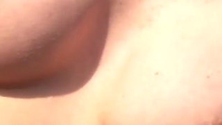 Alone lush Russian babe toys her cunt on the rock on the sea shore