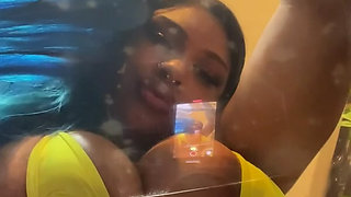 Busty Ebony Girl Rubbing Oiled Tits on a Clear Chair & Riding Her Dildo