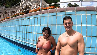 Amy Amor bouncing big natural tits by the pool