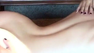 Sexy lesbian couple kiss passionately as they undress each other