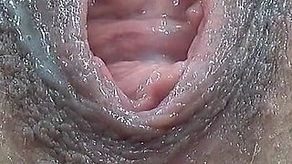 Extreme Close-up of Wet Hairy Vagina with Dildo