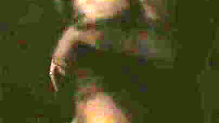 Tattooed teen is dancing in the dark room