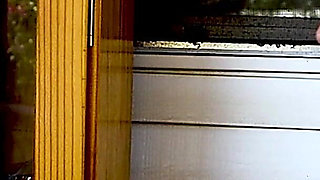 Shaved Head Goth Smokes Outside