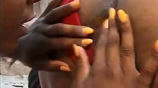 Two hot beautiful ebony chicks are getting their pussies drilled in the garden