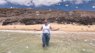 Girl Wetting Jeans in the Ocean and Swimming in Wet White T-shirt