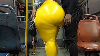 "Masked BBW Teases Huge Ass in Shiny Yellow Leggings on Public Bus"