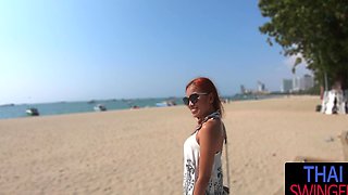 Thai beauty gives sensual glassed POV BJ on tropical Thai beach