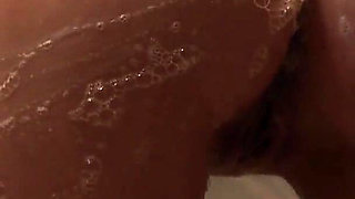 Red-haired Beauty Entertains Herself with Fingers and a Toy Friend in the Shower