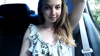 Enticing camgirl puts her lovely tits on display in the car