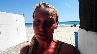 Outdoor solo masturbation scene with curly blonde