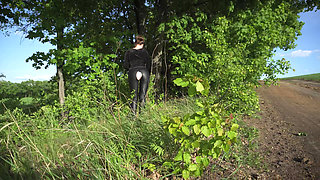 Girl Walking Outdoor In Ripped Leather Leggings